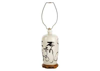 Lot 690 - A Japanese pottery Saki bottle.