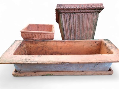 Lot 328 - A terracotta square planter.