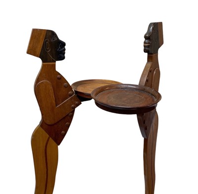 Lot 12 - A pair of mahogany figural dumb waiters.