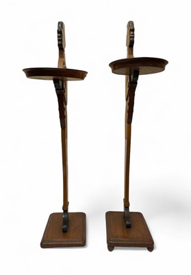 Lot 12 - A pair of mahogany figural dumb waiters.