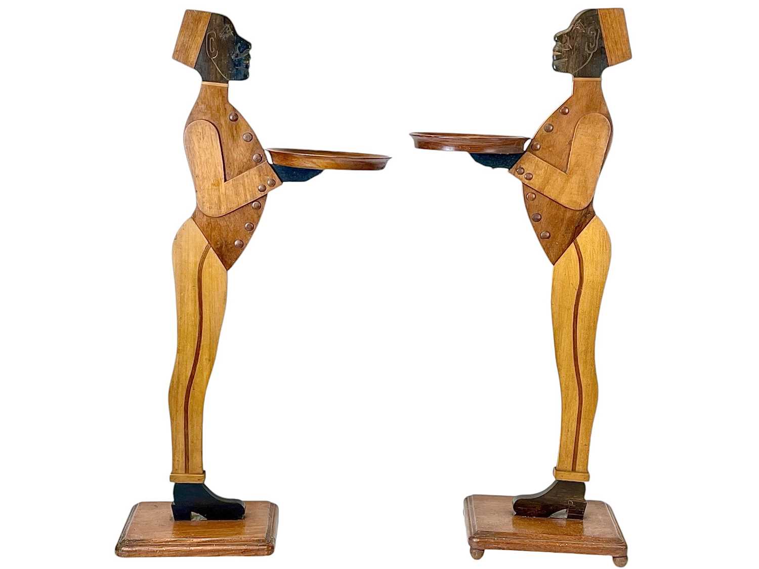 Lot 12 - A pair of mahogany figural dumb waiters.