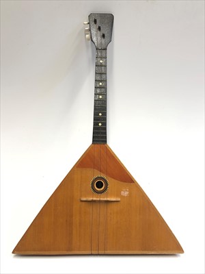 Lot 49 - A Russian three-stringed balalaika, bearing...