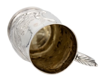 Lot 13 - A George III silver embossed baluster mug, London 1770.