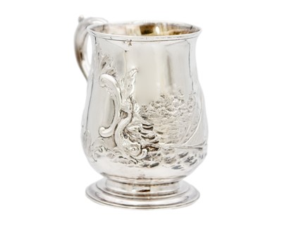 Lot 13 - A George III silver embossed baluster mug, London 1770.