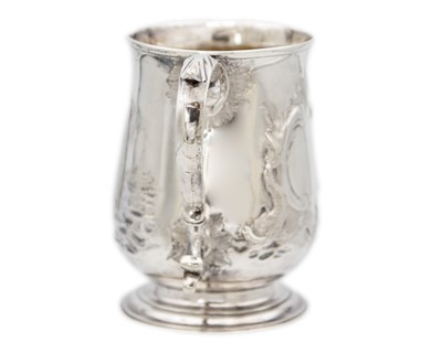 Lot 13 - A George III silver embossed baluster mug, London 1770.