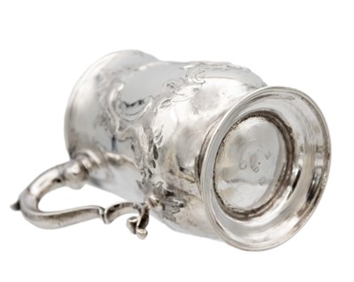 Lot 13 - A George III silver embossed baluster mug, London 1770.