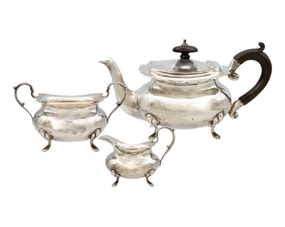 Lot 14 - A George V silver bachelor three piece tea set by Goldsmiths & Silversmiths Co Ltd.