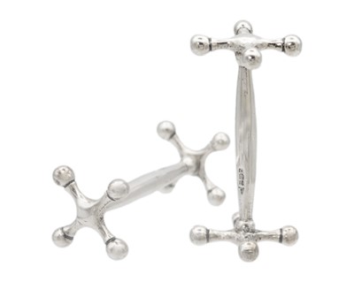 Lot 15 - A George V silver pair of knife rests by Walker & Hall.