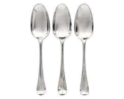 Lot 21 - A George II silver set of three Old English pattern table spoons by Ebenezer Coker.
