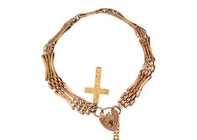 Lot 36 - A 9k rose gold four-bar gate link bracelet with a heart-shaped padlock.