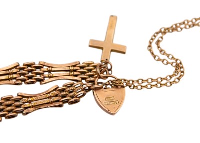 Lot 36 - A 9k rose gold four-bar gate link bracelet with a heart-shaped padlock.