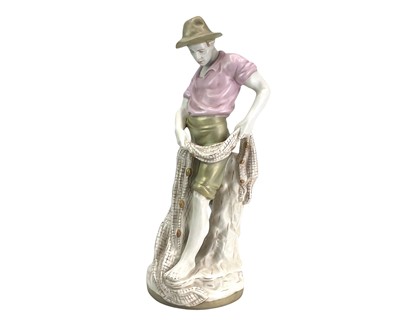 Lot 235 - A Royal Dux figure of a fisherman.