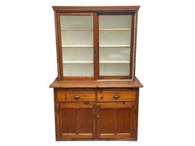 Lot 308 - A stained pine kitchen dresser.
