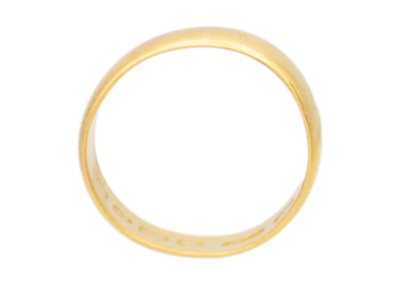 Lot 22 - A 22k yellow gold wide band ring.