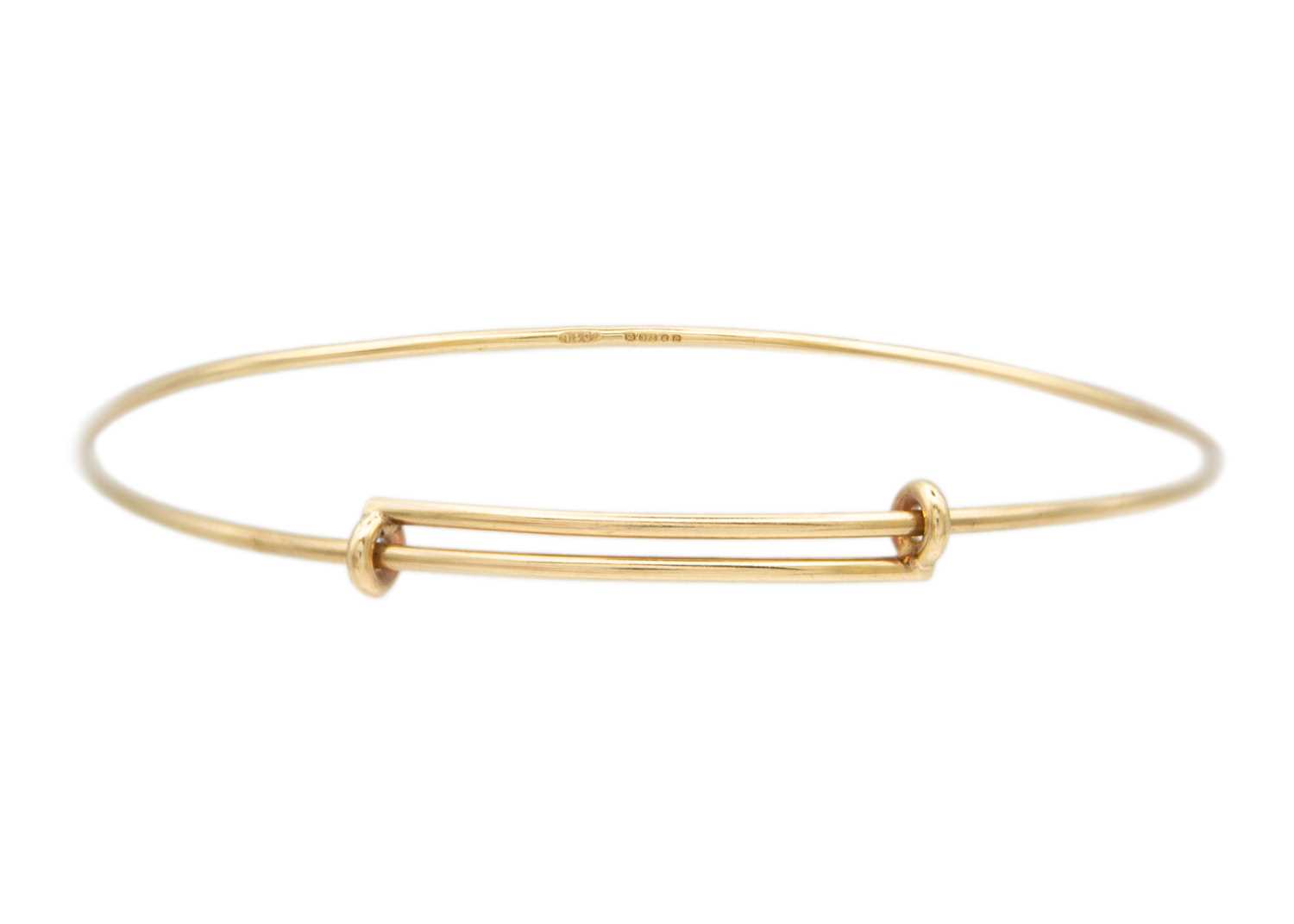 Lot 24 - A Tiffany & Co 9k gold adjustable wire bangle.
