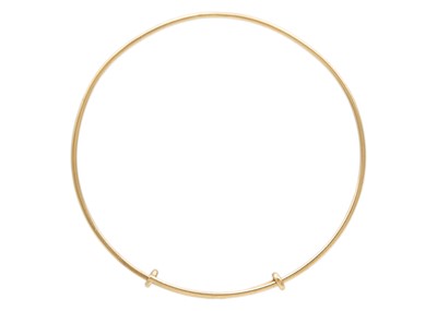 Lot 24 - A Tiffany & Co 9k gold adjustable wire bangle.