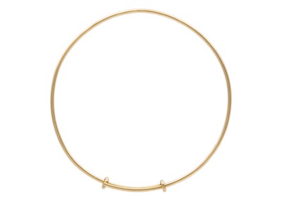 Lot 25 - A Tiffany & Co 9k gold adjustable wire bangle.