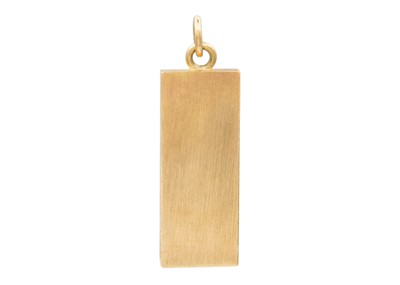 Lot 26 - A 9k gold ingot pendant.