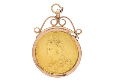 Lot 48 - A full sovereign coin encased in a 9k gold pendant.