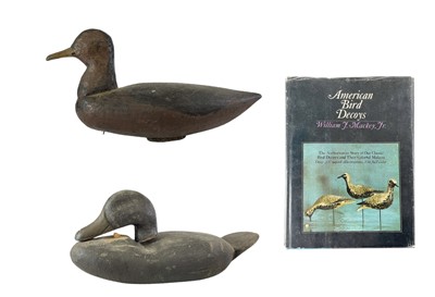Lot 300 - An American painted carved wood duck decoy.