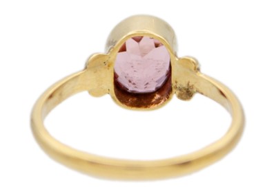Lot 46 - A 14k gold pink tourmaline solitaire ring.
