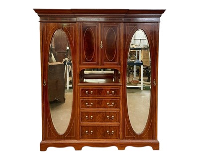 Lot 463 - An Edwardian mahogany inlaid triple wardrobe.