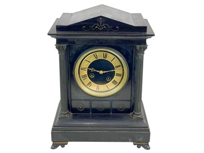 Lot 383 - A Victorian Aesthetic Movement black slate mantle clock.