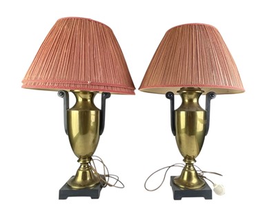 Lot 318 - A pair of brass urn table lamps.
