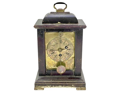 Lot 378 - A small continental pearwood cased timepiece.