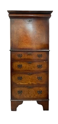 Lot 483 - A walnut veneered tallboy chest.