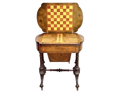 Lot 447 - A Victorian burr walnut games and sewing table.