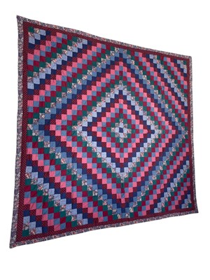 Lot 293 - A patchwork quilt.