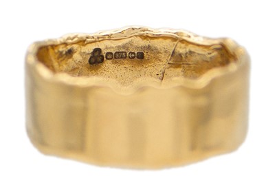 Lot 42 - A 9k gold wide band ring.