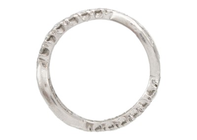 Lot 11 - A diamond fancy crossover band ring in platinum.