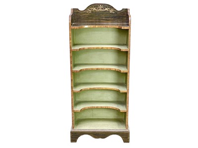 Lot 517 - A Regency style simulated rosewood open bookcase.
