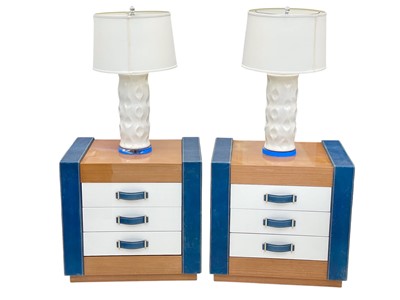 Lot 397 - Superyacht furnishings, a pair of highly laquered veneer bedside tables with integrated lamps.