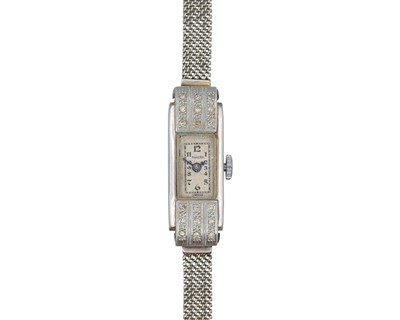 Lot 1202 - An Art Deco platinum diamond set cocktail watch on a 9ct white gold bracelet.