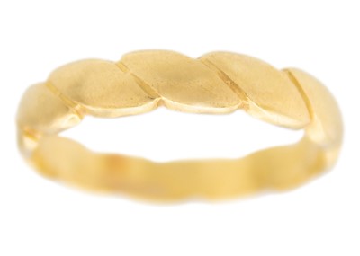 Lot 75 - An 18k band ring of a plaited design.