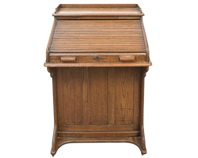 Lot 461 - An oak narrow roll top desk.
