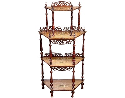 Lot 441 - A Victorian walnut and inlaid four-tier whatnot.