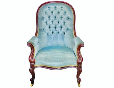 Lot 437 - A Victorian mahogany show frame button back armchair.