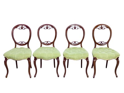 Lot 438 - A set of four Victorian walnut balloon back dining chairs