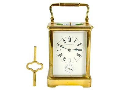 Lot 388 - A French repeating brass carriage alarm clock.