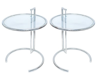 Lot 260 - A pair of chrome and glass E1027 tables, after Eileen Gray.