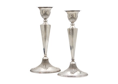 Lot 248 - A pair of George V silver Adam-style candlesticks.