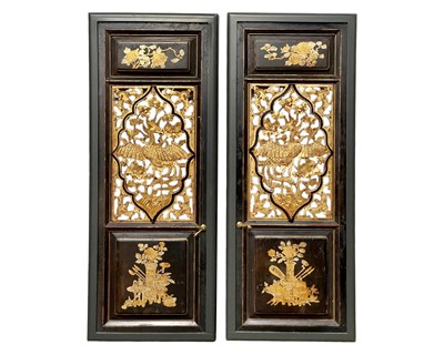 Lot 631 - A pair of Chinese lacquered and carved gilt panels or doors.