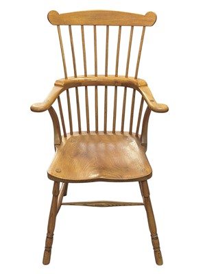 Lot 449 - A comb back ash and elm Windsor armchair by Peter Marshall.
