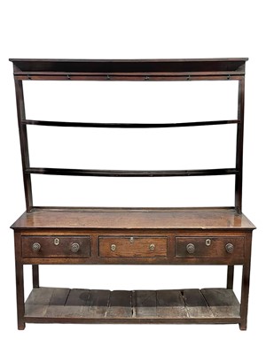 Lot 310 - A George III oak dresser and rack.