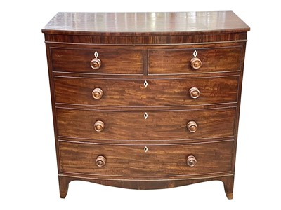 Lot 509 - A late George III mahogany bow front chest.