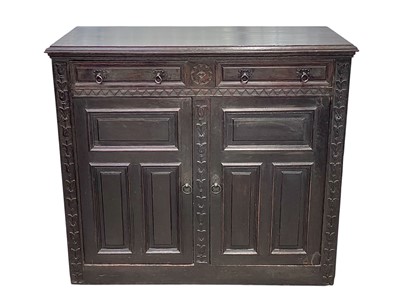 Lot 473 - A Continental carved oak buffet.